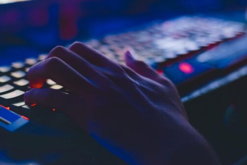 typing on keyboard in dark